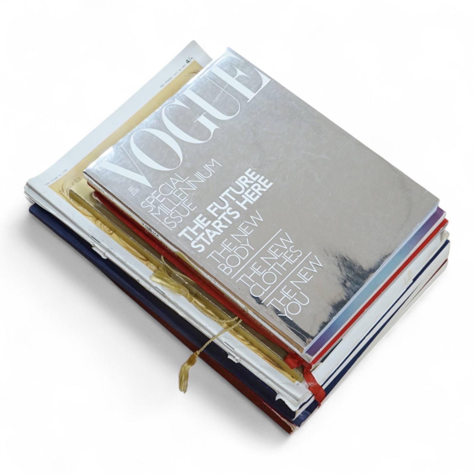 A collection of commemorative books and magazines to include Vogue
